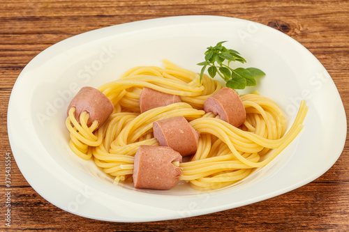 Kids pasta spaghetti with sausages