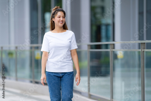 Woman in white t-shirt and blue jeans