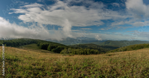 Panorama view from Duze Jaslo hill in summer cloudy morning