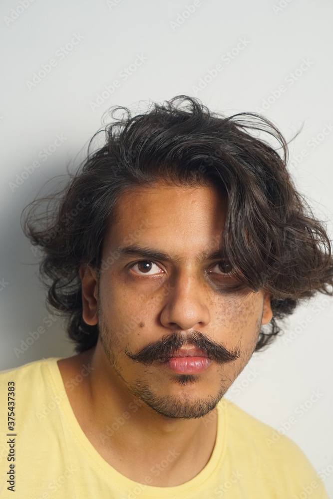 young man with intense looks young man with intense looks