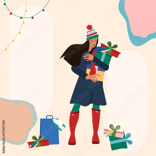 Cute young woman in warm winter clothes making holiday shopping.Carrying Christmas presents from street market in hands.Truss of gift boxes with bow,packets lie around.Template for your wish text