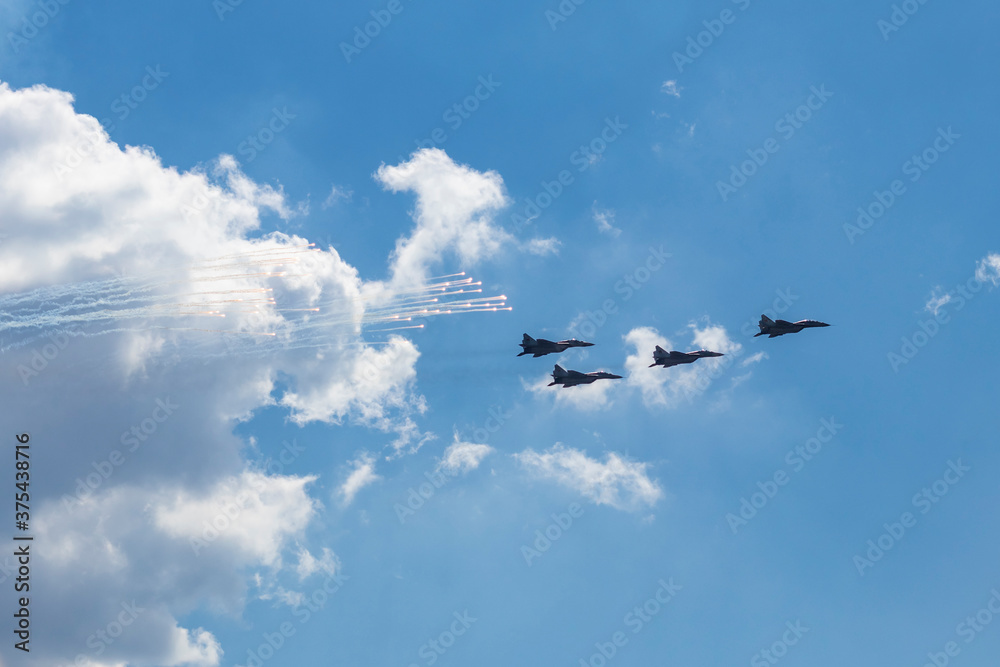 Daylight. combat vehicle aircraft in the amount of four pieces. blue sky. Daylight. combat vehicle aircraft in the amount of four pieces. blue sky.
