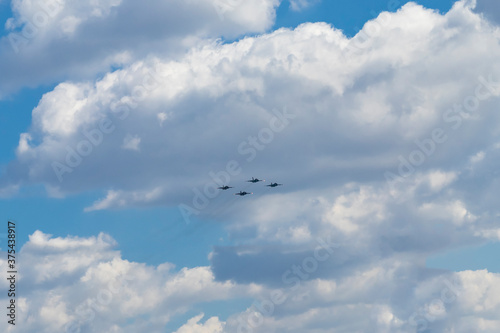 Daylight. combat vehicle aircraft in the amount of four pieces. blue sky.
