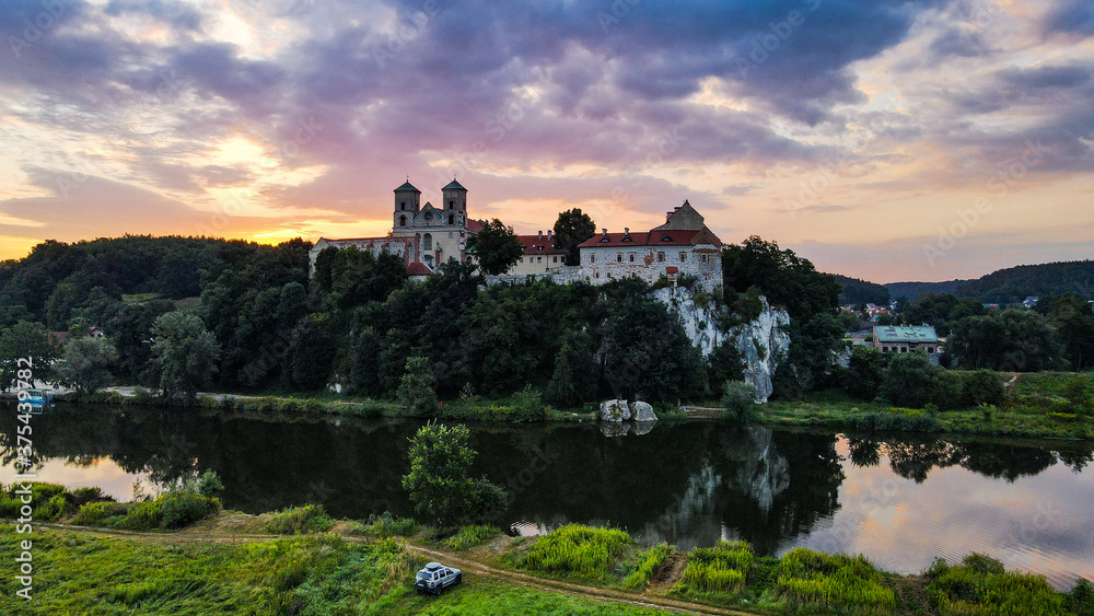 Picturesque Tyniec near Krakow, Poland. Benedictine Abbey, Monastery and Church on the Cliff by Vistula River. Aerial Drone View at Sunrise
