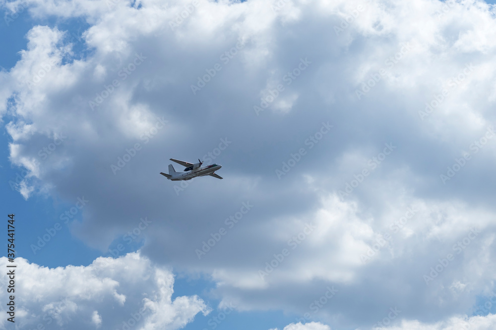 Daylight. large aircraft accompanied by combat vehicles. blue sky Daylight. large aircraft accompanied by combat vehicles. blue sky
