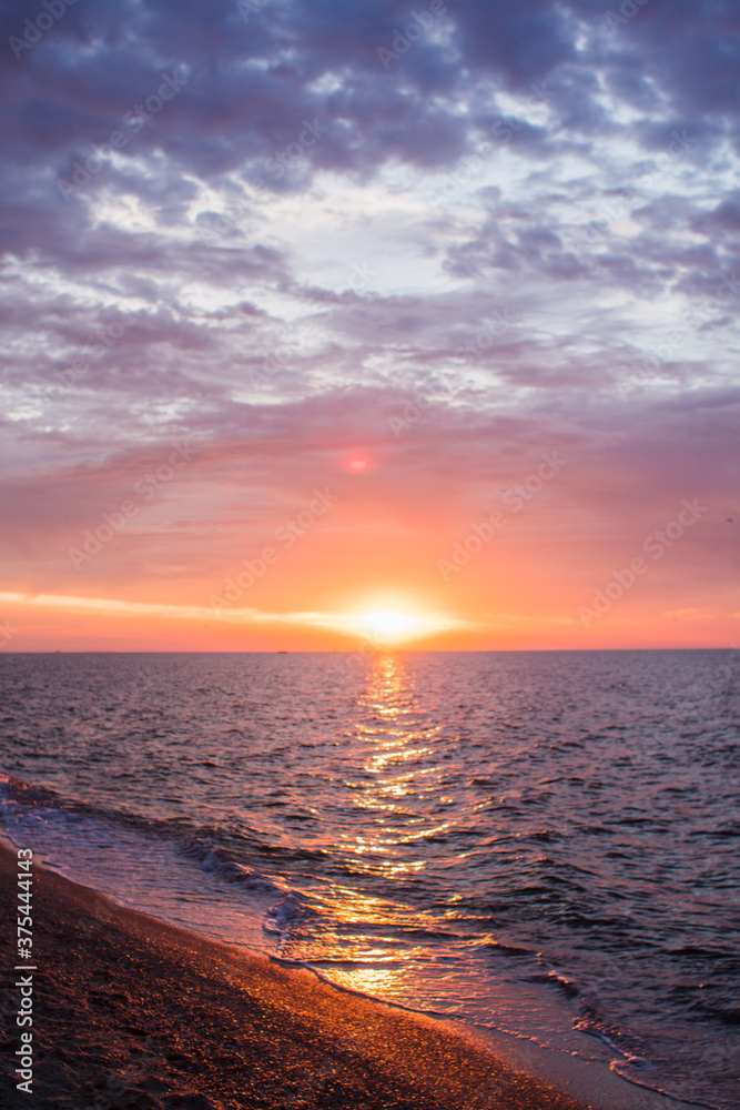 beautiful sunrise at sea with clouds