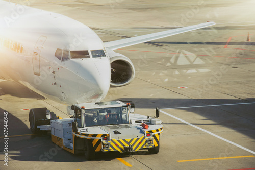 Towing the aircraft from the boarding bridge to the apron before departure.