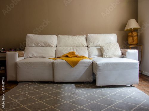 living room with white sofa and neutral tones, no person
