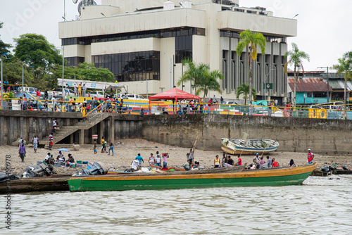 Quibdó, Chocó, Colombia. March 5, 2019: People close to boats on the Atrato River photo