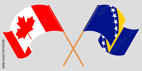Crossed and waving flags of Canada and Bosnia and Herzegovina