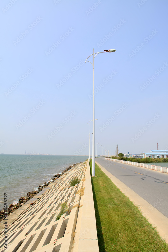 coastal groyne and road lamp