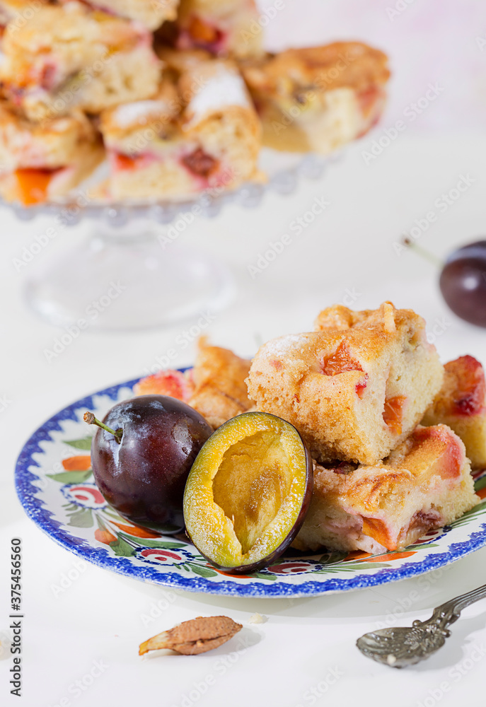 Portion of Plum Cake on a plate Portion of Plum Cake on a plate