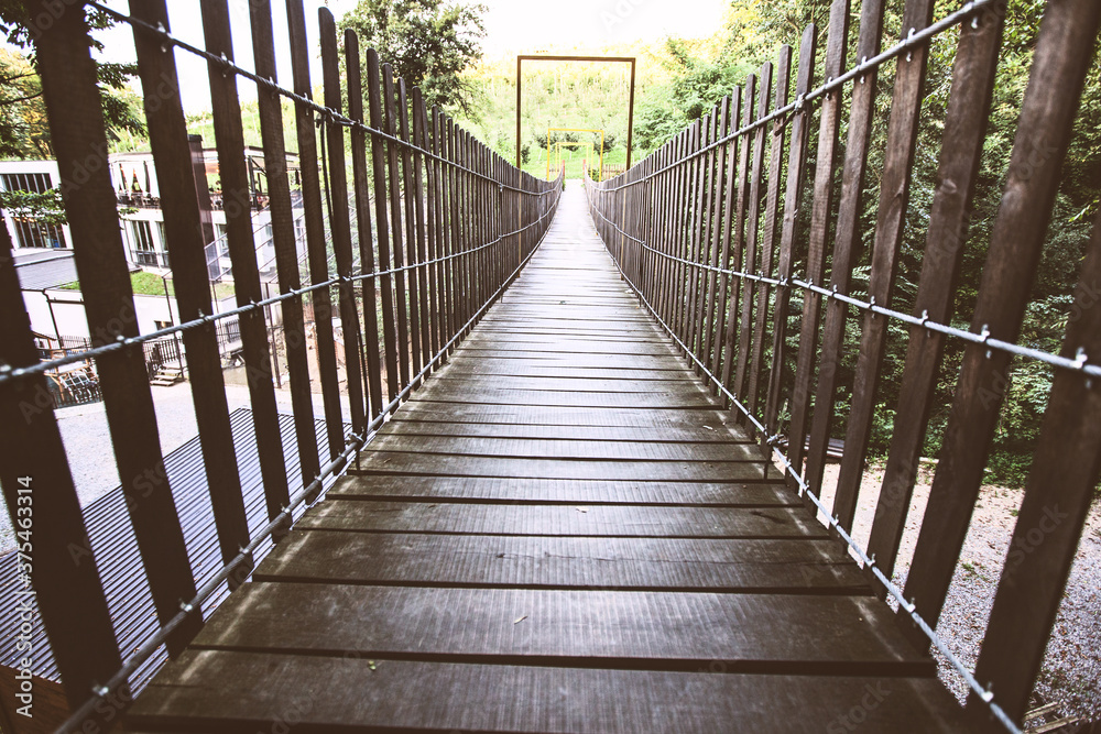 Wooden Suspension Bridge, Pedestrian Hanging Footbridge, Summer Day Wooden Suspension Bridge, Pedestrian Hanging Footbridge, Summer Day