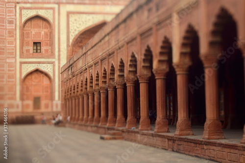 One of the buildings in Taj Mahal complex with arches and columns. Selective focus made with tilt-shift effect. Agra  Uttar Pradesh  India