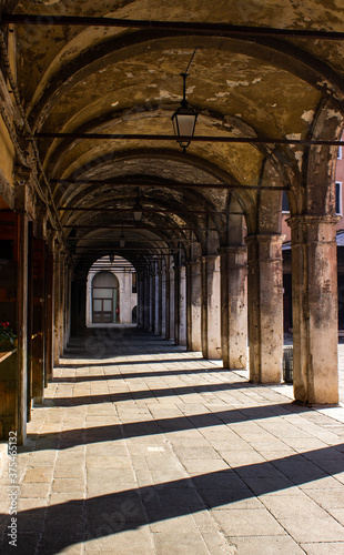 Sottoportico near Rialto with columns and vaulted ceiling without passersby. Venice, Italy.