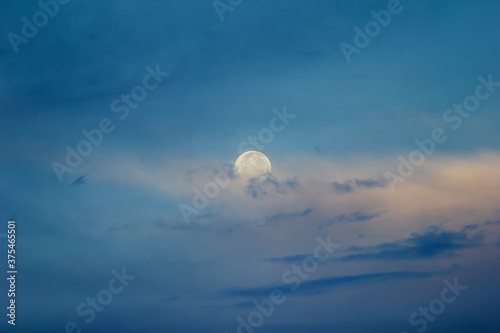 Full moon over the clouds
