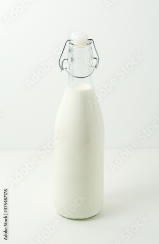 A glass bottle filled with milk