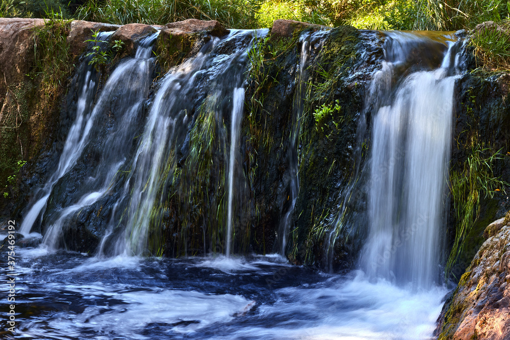 Fototapeta premium Waterfall in a river in the forest