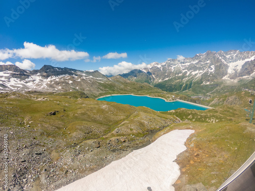 Artificial lake for hydroelectric power plant surrounded with mountains.