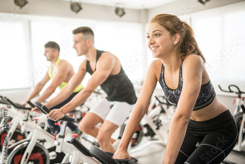 Group of people training on exercise bikes
