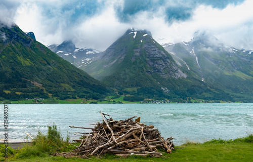 The idyllic beautiful village of Hjelle on the shores of lake Strynsvatnet at the end of Hjelledalen valley, near the Jostedalbreen National Park, Norway. photo