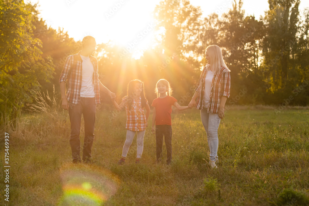 Happy family on sunset in nature Happy family on sunset in nature