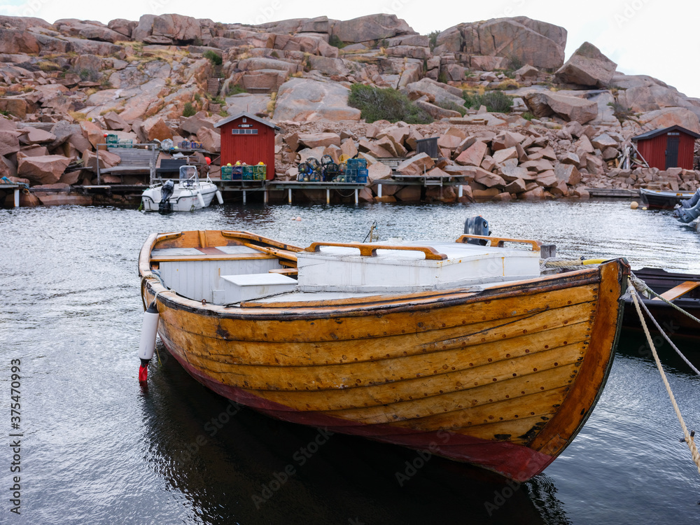 Beautiful varnished wooden boat in a harbour in Sweden