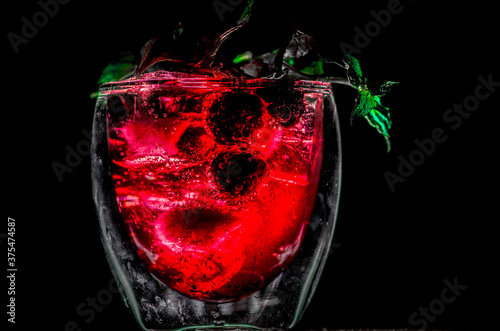 glass containing a red sparkling drink 