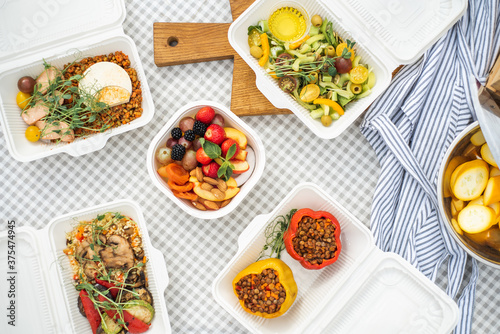 Sat of take away boxes with healthy food on the table. Restaurant dishes. Top view. Flat lay.