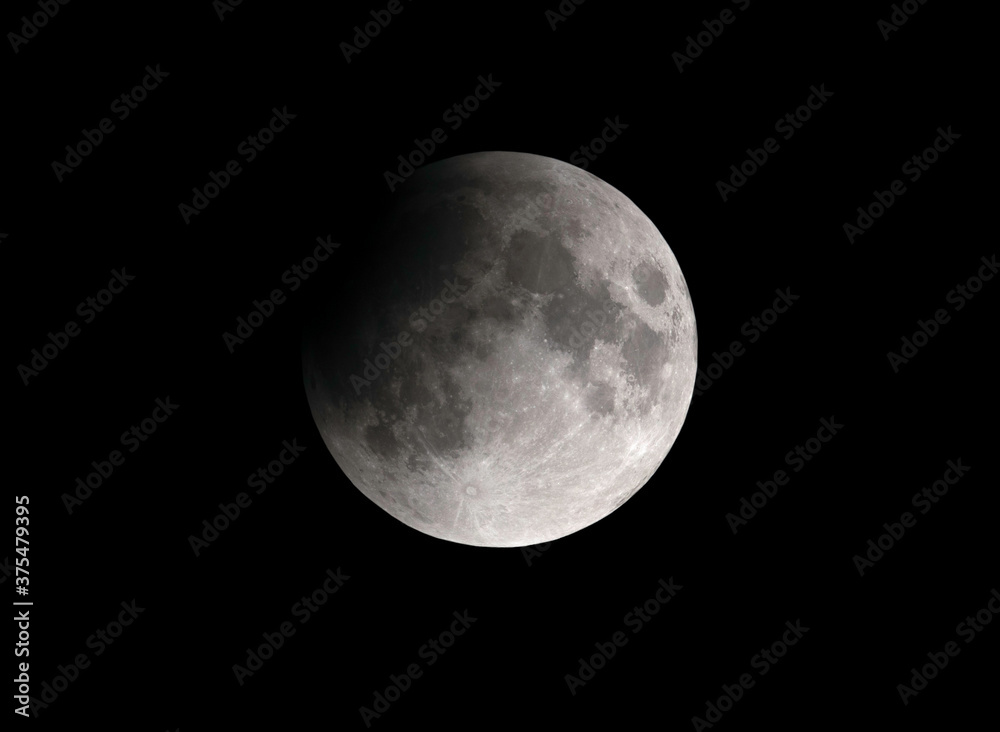 Obraz premium Partial Lunar eclipse visible at Bahrain on 16-17 July 2019
