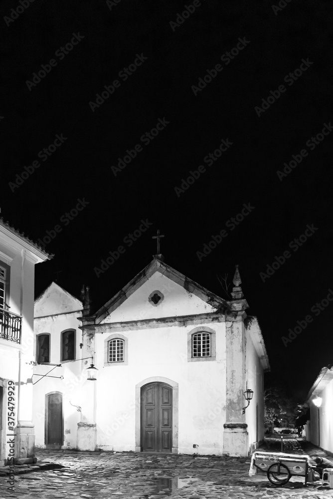 Black and white photo of  vintage catholic church in Brazil at night