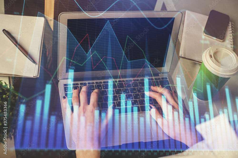 Double exposure of woman hands typing on computer and forex chart hologram drawing. Stock market invest concept. Double exposure of woman hands typing on computer and forex chart hologram drawing. Stock market invest concept.