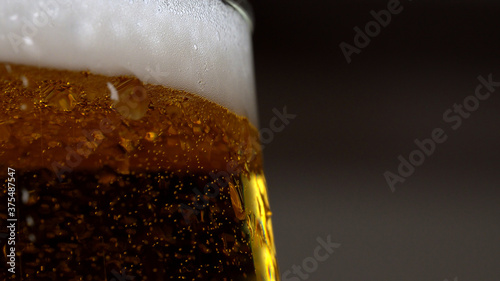 Macro view of beer in the glass.