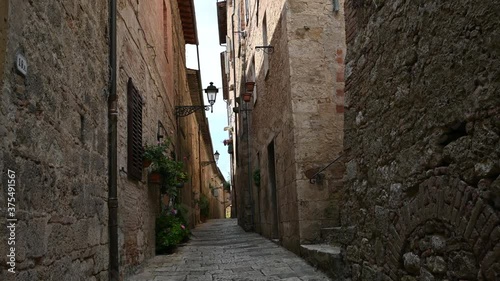 Colle di Val d'Elsa, Tuscany, Italy. August 2020. POV film walking in the alleys of the historic center: enchanting glimpses of medieval times full of charm, you advance along the paving.