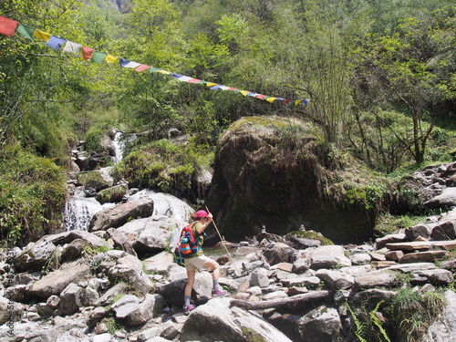 A woman trekking through beautiful nature, ABC (Annapurna Base Camp) Trek, Annapurna, Nepal, ABC (Annapurna Base Camp) Trek, Annapurna, Nepal