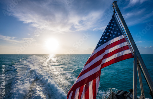 American Flag and Sunrise Over Gulf of Mexico
