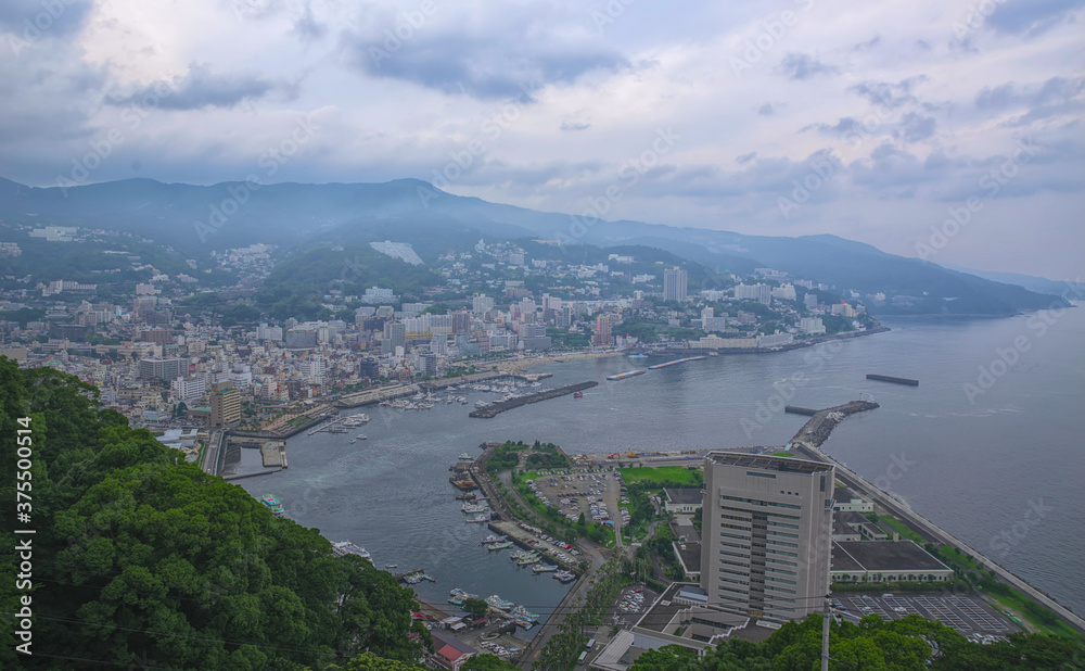 Aerial view of Atami, a seaside resort town southwest of Tokyo, on an overcast summer day