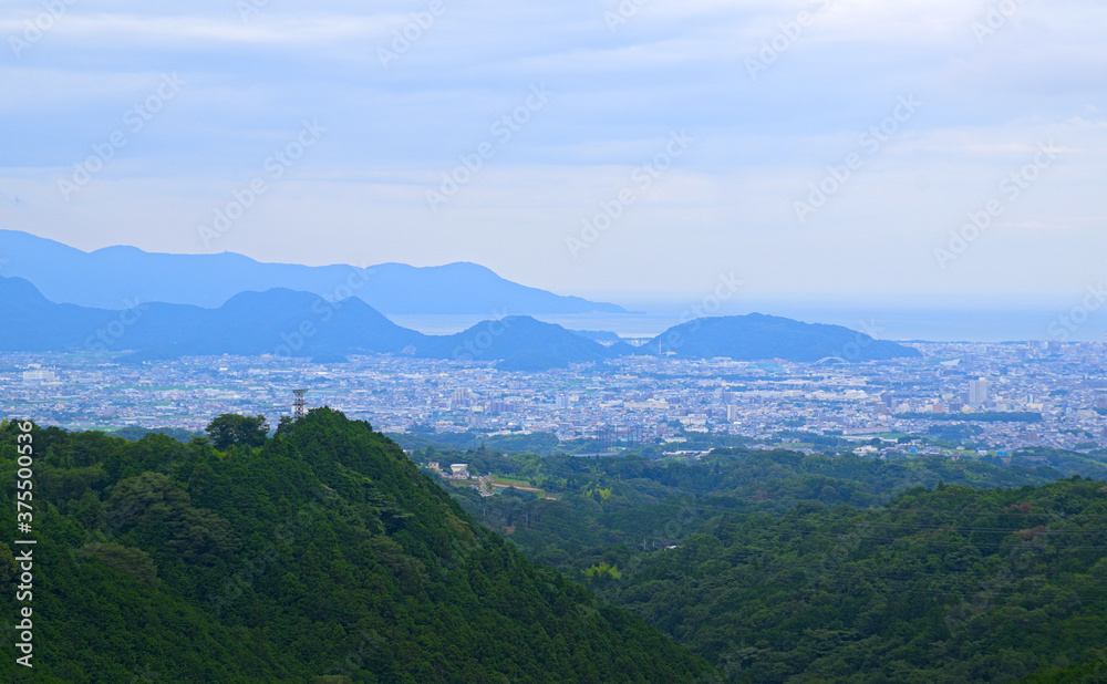 Sweeping view of Mishima, a coastal city southeast of Mount Fuji, on a hazy overcast day