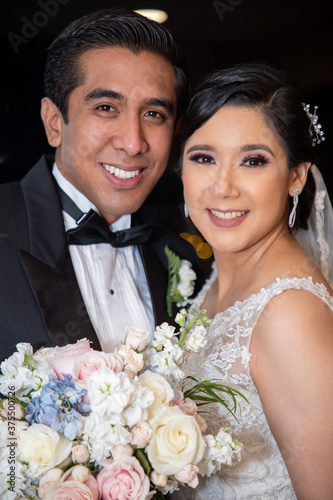 Latino Bride and Groom posing portrait