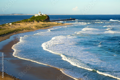 View of Nobby's Beach and lighthouse at the port entrance, Newcastle, NSW, Australia