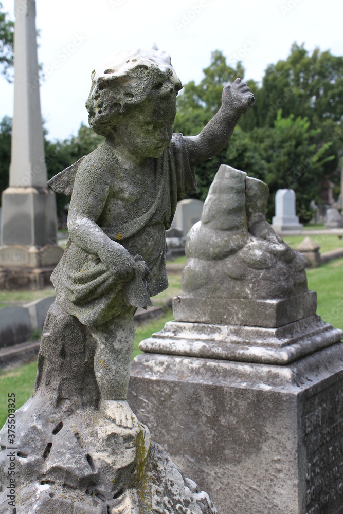 Stone angel child on grave in Hollywood Cemetery, Richmond, Virginia