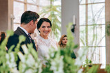 Latino bride and groom looking at each other during the ceremony