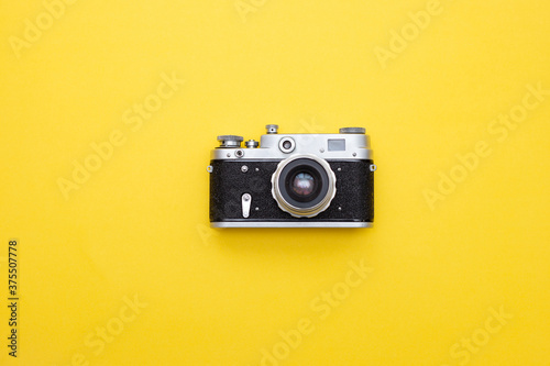 retro camera on yellow background