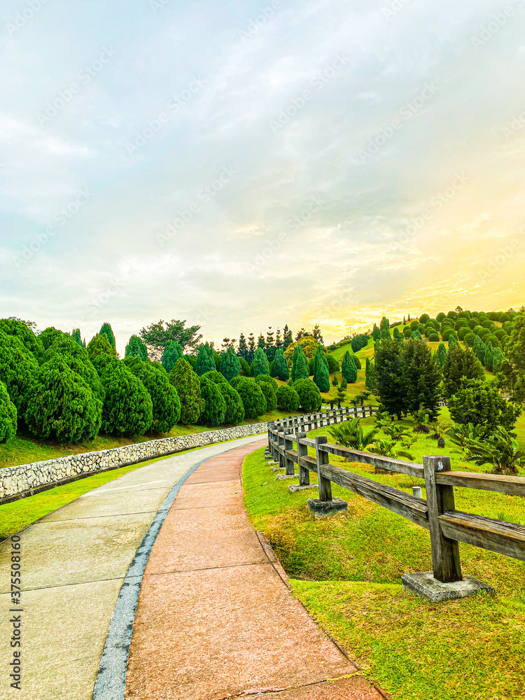 Fototapeta premium road path garden and fence at Saujana Hijau, Putrajaya