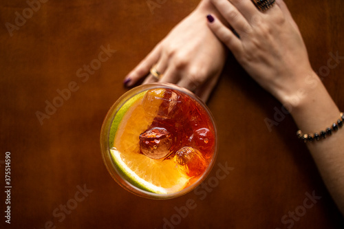 Drink with hand on table