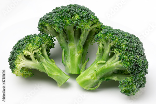 Fresh broccoli with drops of water isolated on white background