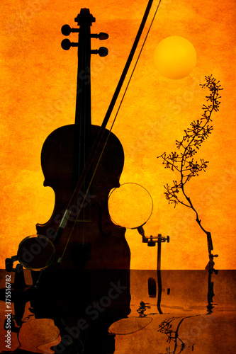 Violin on orange background with reflective surface. Sultry music