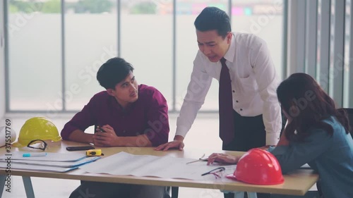 Angry Contractor Boss is yelling at construction team in a meeting room for failure in project plan.
