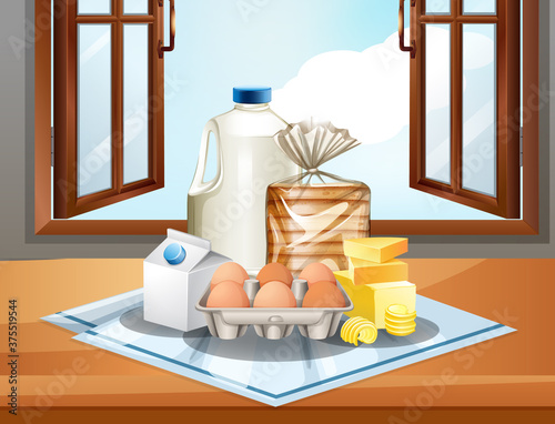 Group of baking ingredients such as milk butter and eggs on window background