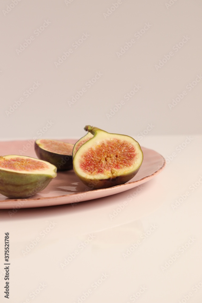 Fig fruit on a plate photo, figs food photo on white background Fig fruit on a plate photo, figs food photo on white background